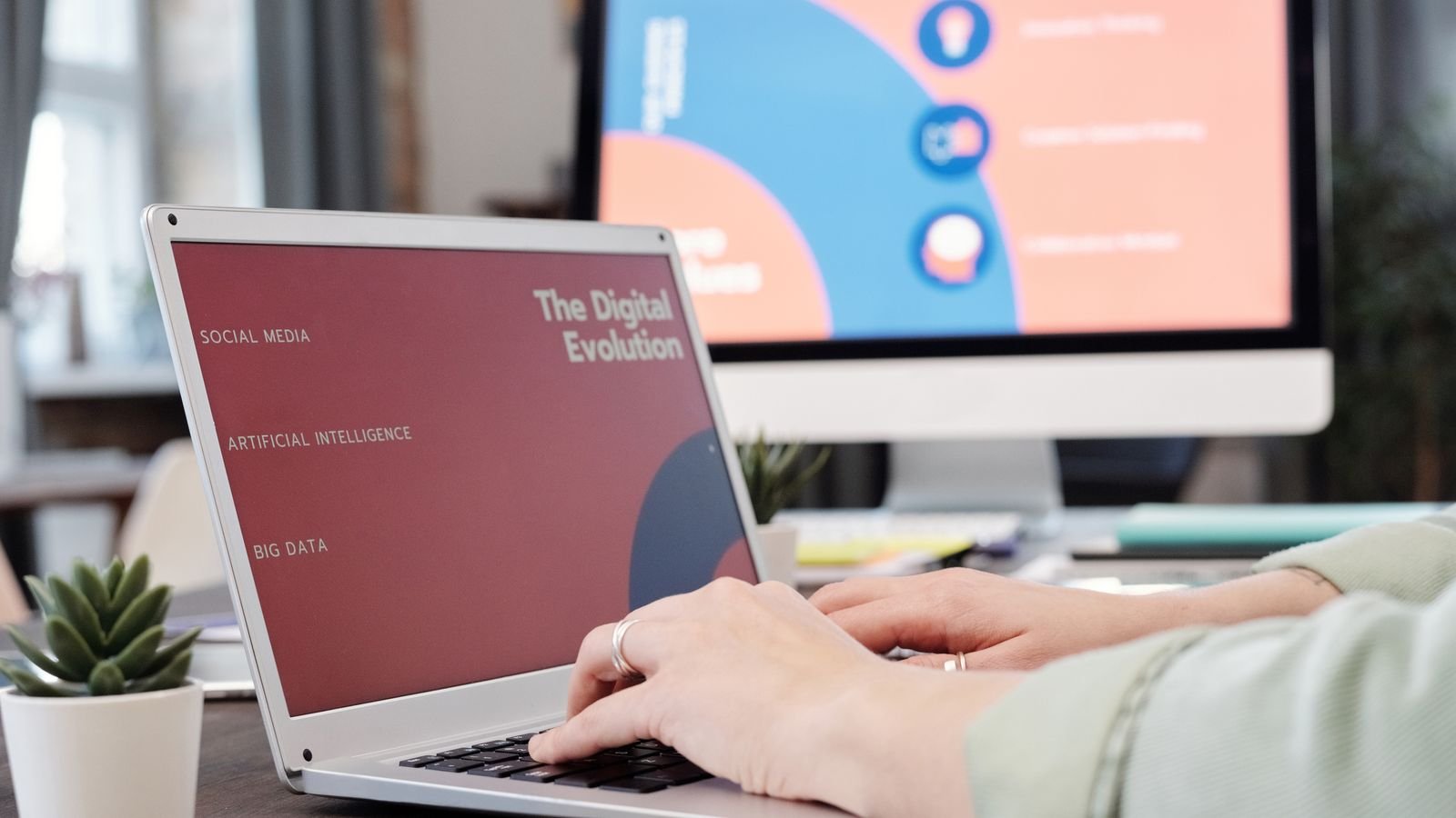Person typing on a laptop with a digital technology concept displayed on the screen